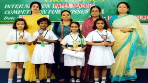 Winners of ‘Paper Reading’ competition posing with Headmistress and other faculty members of the school.