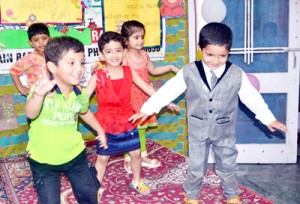 Kids performing activity during Grandparents Day at Daffodils School in Jammu.