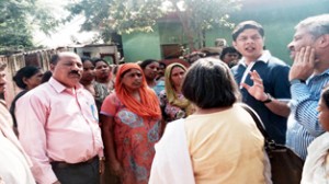 BJP leaders interacting with flood affected people at Gorkha Nagar in Jammu.