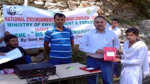 A student being awarded prize during National Environment Awareness Campaign on Monday.