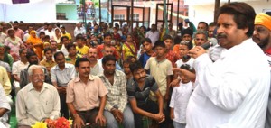 Minister for Housing, Raman Bhalla addressing public gathering at Jammu on Sunday. 