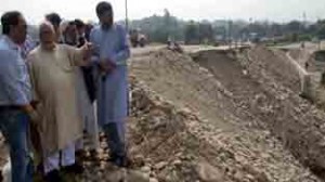 Minister for R&B, Abdul Majid Wani inspecting restoration work of fourth Tawi bridge on Sunday.