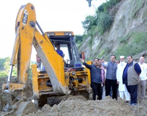 Provincial President NC Devender Singh Rana and MoS Home and PWD Sajjad Kichloo inspecting restoration of Jammu-Surinsar-Mansar Road on Sunday.