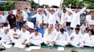 NPP workers staging protest outside Raj Bhavan in Jammu on Wednesday.       -Excelsior/Rakesh