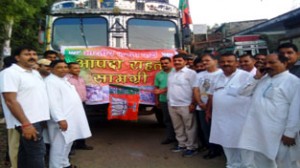 BJP leaders flagging off relief trucks for flood victims of Jammu on Sunday. 