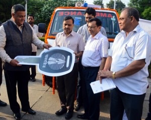 Powergrid Executive Director S K Sharma handing over ambulance to GMC Principal Dr Ganshyam on Tuesday.