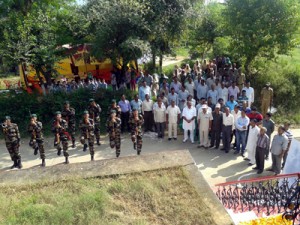 Army jawans and people paying tributes to martyr at Nowshera on Tuesday.