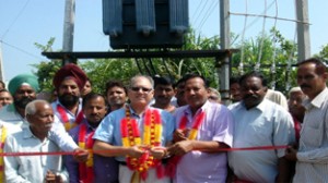 MLC BR Kundal dedicating transformer to public at Tara Chak in Tehsil Bishnah.