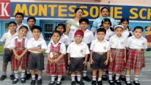 Students of  JK Montessorie School posing during English and Hindi calligraphy competition