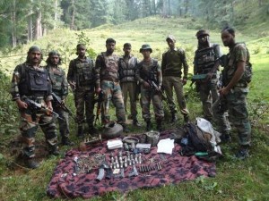 Jawans pose with consignment of arms, ammunition and explosives at Badani Nullah in Bhaderwah on Saturday.