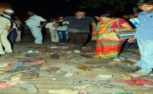 People searching goods and shoes after stampede during function of Dussehra festival at Gandhi Maidan in Patna on Friday.(UNI)