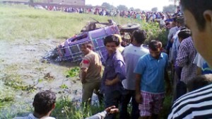 The ill fated mini-bus which turns turtle and rolled down into a field at Deoli in Bishnah area of Jammu district on Sunday.