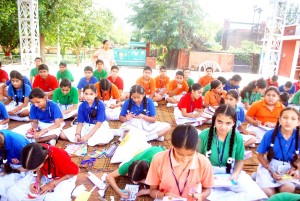 Students of Vishwa Bharti School displaying their skills in Card making contest at its school premises in Jammu on Monday.