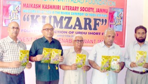 Chief guest and other dignitaries during release of Urdu  book “Kumzarf” on Saturday.