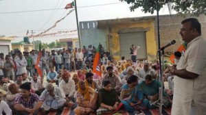 Chander Parkash Ganga addressing a public meeting at Chak Babral on Sunday.