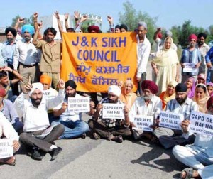 Members of Sikh Council and locals staging protest at Beli Charana in Jammu on Monday.
