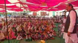 Former Minister & MLA Surjeet Singh Slathia addressing public gathering at Vijaypur on Sunday.