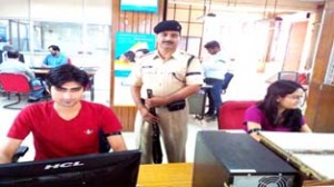 Bank employees wear black badges to lodge protest in Jammu on Friday.