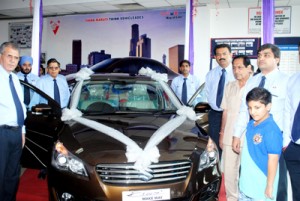 Officials of Jamkash Vehicleades Private Limited launching mid-size premium sedan ‘Ciaz’ at Jammu on Thursday. -Excelsior/Rakesh