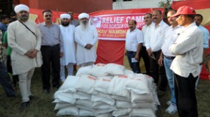 Namdhari Sangat distributing relief material among Pak firing victims at Domana.