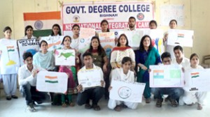 Participants of Poster Making Competition posing for a group photograph along with their posters at GDC Bishnah. 