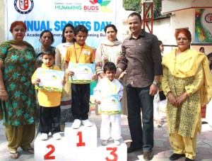 Winners of a sports event posing for a photograph during prize distribution ceremony, at Model Academy, Jammu.