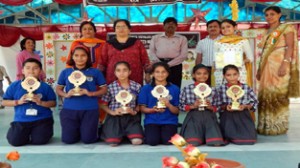 Winners of various sports events posing for a group photograph during concluding ceremony of sports meet.