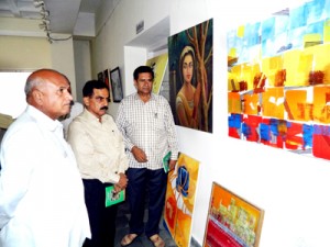 Bharat Bhushan, along with Director Tourism during an inaugural function of painting exhibition at Jammu on Thursday.