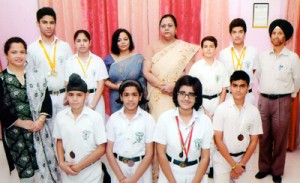 Students of DPS Jammu, who won medals in Inter-School Swimming Competition, posing with Principal Dr Joseph and others at Jammu.