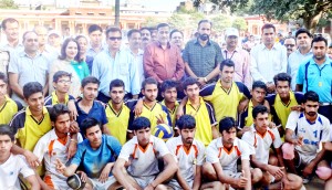 Winning team of U-19 Boys Volleyball Tournament posing for a group photograph with Minister of PHE, Sham Lal Sharma and others at Akhnoor.