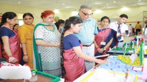 A BEd student briefing the dignitaries about a model during an exhibition on teaching aids at PG Department, MIER College of Education, Jammu.