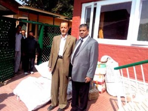 Chief Justice of State High Court, Justice M M Kumar handing over relief material to J&K Yateem Trust, Srinagar on Thursday.