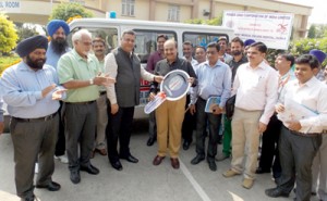 Powergrid ED, SK Sharma handing over key of ambulance donated to GMC Patiala.