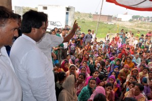 Minister for Housing, Raman Bhalla addressing flood victims of Belicharana on Saturday.