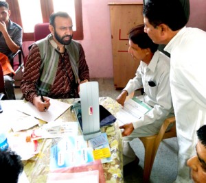 HoD Cardiology GMC Jammu Dr Sushil Sharma examining patients at Suchani in a free medical camp on Sunday.