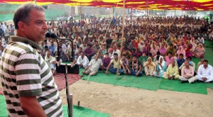 BJP MLA Ashwani Sharma addressing a public meeting at Saidgarh, Bishnah on Sunday.