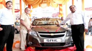 Officials of KC Motors unveiling all new Chevrolet Sail at Jammu on Tuesday. -Excelsior/Rakesh