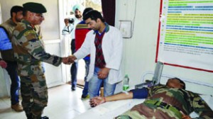 15 Core Commander, Lt Gen Subrata Saha, during a blood donation camp in Sopore on Saturday.     Excelsior/Aabid Nabi