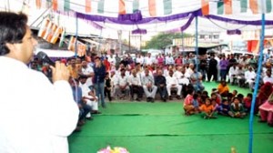 Minister for Housing Raman Bhalla addressing a public gathering at Bagh-e-Bahu.