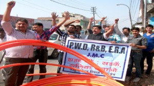 Sunil Dimple, president Jammu West Assembly Movement and others holding protest demonstration on Tuesday.