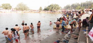 Devotees taking holy dip in sacred pond at Bawe Talab during Jhiri Mela on Thursday.—Excelsior/Rakesh