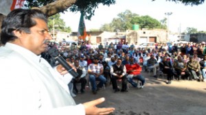 Minister for Housing Raman Bhalla addressing public meeting on Sunday.