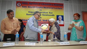 Memento being presented during Shanti Gupta Memorial Lecture at MIER on Saturday. 
