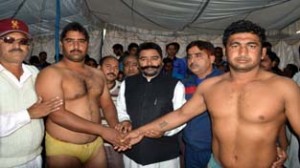 Wrestlers shaking hand before a bout during Panjpeer Dangal at Jammu.