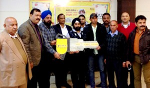 Officials of Jaypee Cement handing over key of Maruti car to winner of Scratch Card Coupon Scheme.        -Excelsior/Rakesh