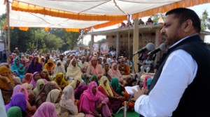 Ex-MP Madan Lal Sharma addressing public rally in Akhnoor on Monday. 