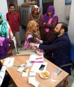HoD Cardiology GMC Jammu, Dr Sushil Sharma examining patients at village Ratnuchak in Jammu on Sunday.
