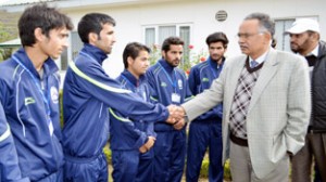 Vice Chancellor BGSBU Prof Irshad A Hamal interacting with footballers while flagging off the University’s football team.