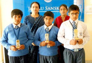 Winners of ‘Listening Comprehension Activity’ posing along with Principal of Jammu Sanskriti School, Rohini Aima on Monday. 