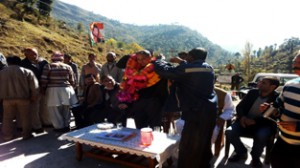 MLA Shabir Khan being greeted by public at Ghambir Mughlan in Rajouri on Monday.